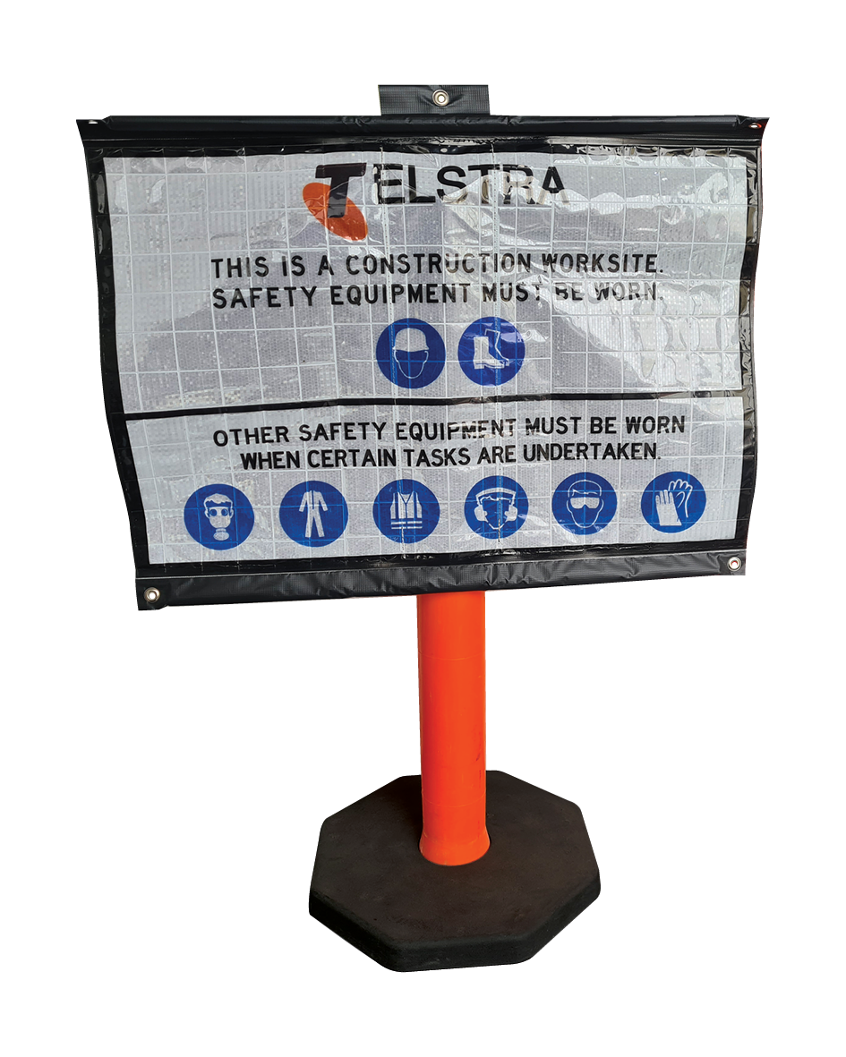 A Reflective Bollard Roll Up Sign with the Telstra logo and various safety symbols such as hard hats, safety glasses, and high-visibility vests.
