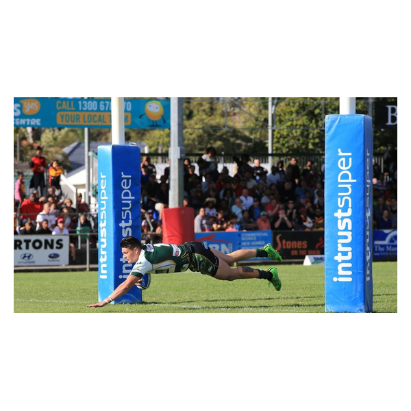 Blue Intrust Super rugby goal post pads installed on the field during a match.