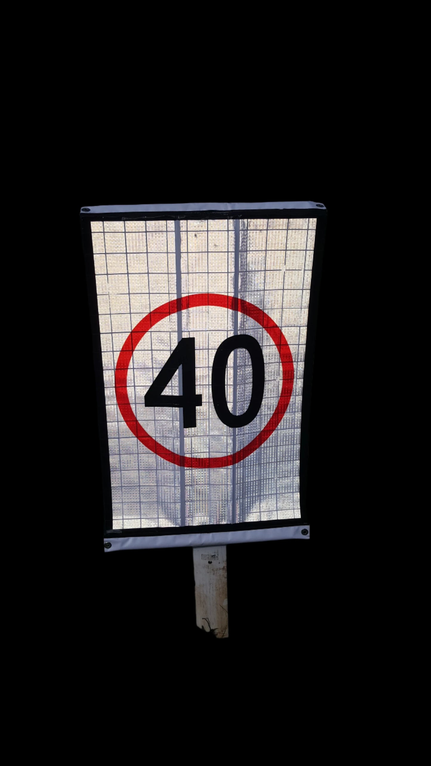 Reflective Speed Guide Post Roll Up Sign high visibility in nighttime. 