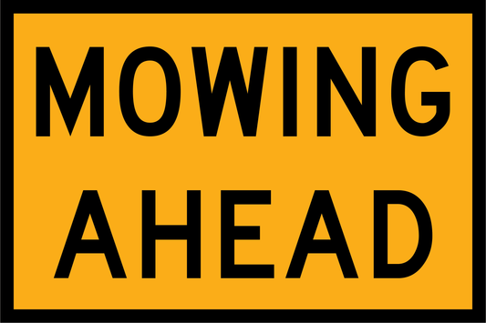 Yellow sign with 'MOWING AHEAD' text on a black border