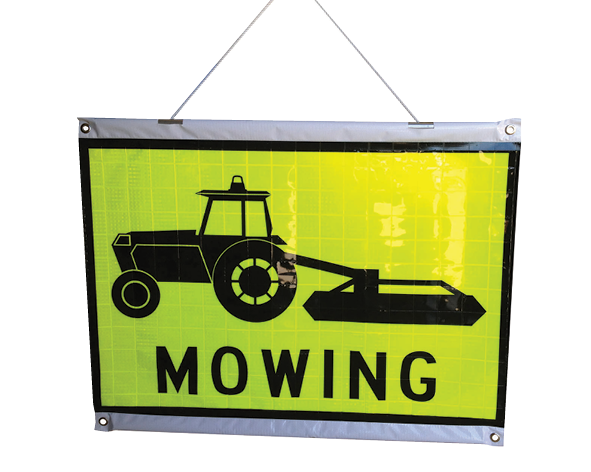 A Rods and Cords Hanging Roll Up Safety sign with a black silhouette of a tractor and the word 'Mowing' printed below it. The sign has top and bottom stiffening rods and is designed for roll-up display.