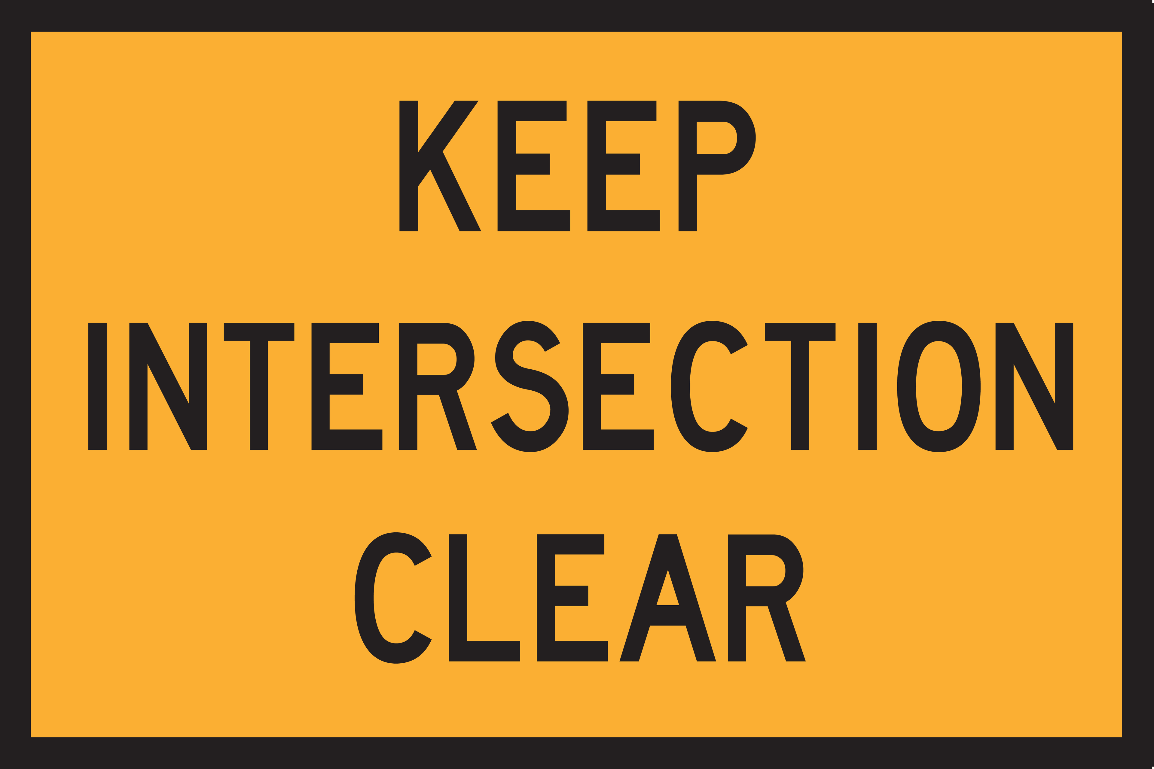Yellow sign with 'KEEP INTERSECTION CLEAR' text on a black border