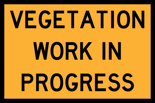 Warning sign with text 'Vegetation Work in Progress' on a yellow background